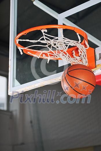 oreange basket ball in basketball basket oreange basket ball in basketball basket