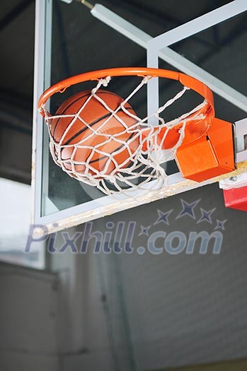 oreange basket ball in basketball basket oreange basket ball in basketball basket