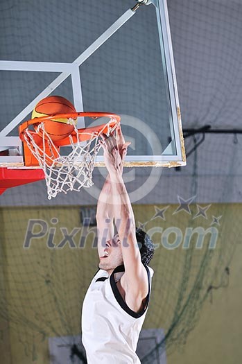 one healthy young man play basketball game in school gym indoor one healthy young man play basketball game in school gym indoor