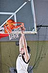 one healthy young  man play basketball game in school gym indoor
