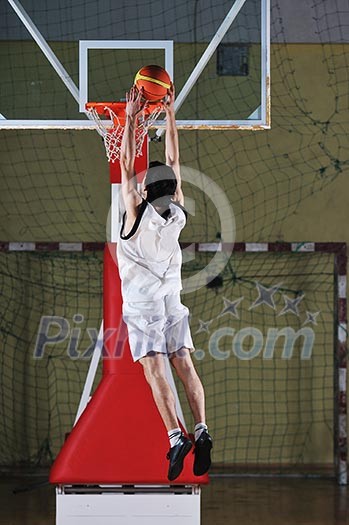one healthy young man play basketball game in school gym indoor one healthy young man play basketball game in school gym indoor