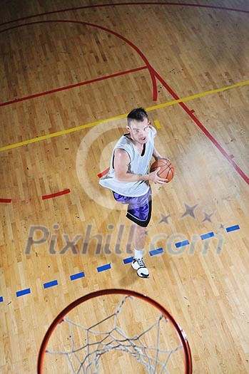 one healthy young man play basketball game in school gym indoor one healthy young man play basketball game in school gym indoor