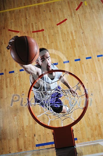 one healthy young man play basketball game in school gym indoor one healthy young man play basketball game in school gym indoor
