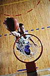 one healthy young  man play basketball game in school gym indoor