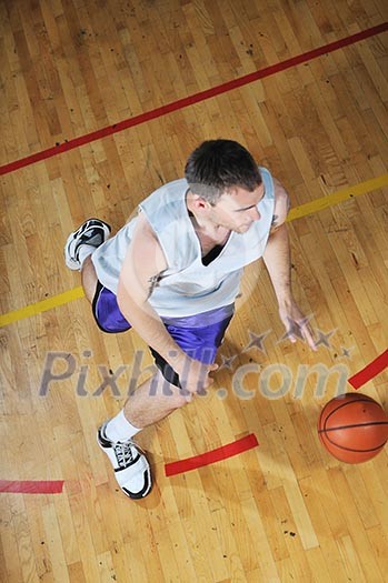 one healthy young man play basketball game in school gym indoor one healthy young man play basketball game in school gym indoor