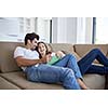romantic relaxed young couple at modern home using tablet computer