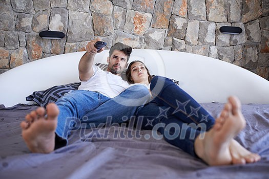 happy young couple relax and have fun in bed happy young couple relax and have fun in bed