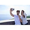 cheerful happy young couple making selfie togethe