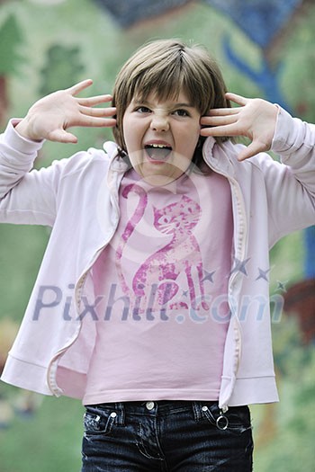happy young girl posing and jumping with abstract urban style painting bacground begind happy young girl posing and jumping with abstract urban style painting bacground begind