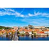 Prague: Mala Strana,  Charles bridge and Prague castle view from Old Town bridge tower over Vltava river in daytime. Prague, Czech Republic