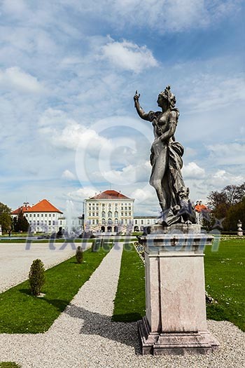 Statue Grand Parterre Baroque garden and the rear view of the Nymphenburg Palace. Munich, Bavaria, Germany Statue Grand Parterre Baroque garden and the rear view of the Nymphenburg Palace. Munich, Bavaria, Germany