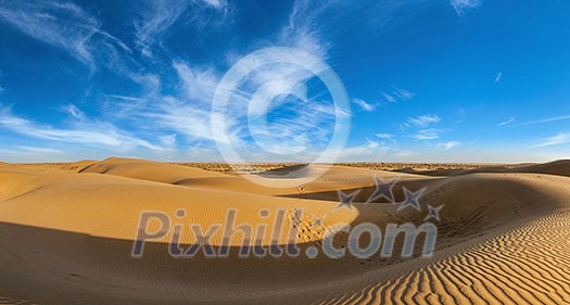 Panorama of dunes landscape with dramatic clouds in Thar Desert. Sam Sand dunes, Rajasthan, India Panorama of dunes landscape with dramatic clouds in Thar Desert. Sam Sand dunes, Rajasthan, India