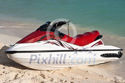 Jet ski on beach sand near sea Jet ski on beach sand near sea