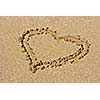 Heart drawn on beach sand