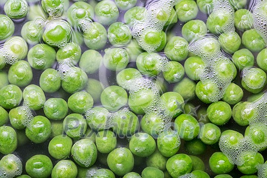 Green peas being boiled in a pot