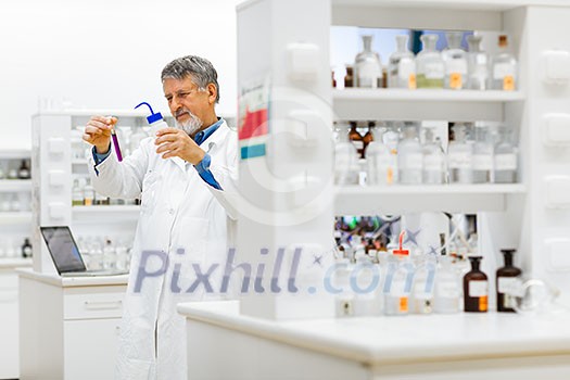 Senior male researcher carrying out scientific research in a lab (shallow DOF; color toned image) Senior male researcher carrying out scientific research in a lab (shallow DOF; color toned image)