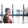 Female swimmer in an indoor swimming pool - going for her swim (shallow DOF)