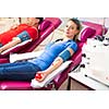 Young woman giving blood in a modern hospital