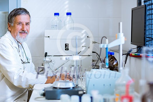 Senior male researcher carrying out scientific research in a lab (shallow DOF; color toned image) Senior male researcher carrying out scientific research in a lab (shallow DOF; color toned image)