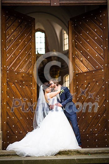 Portrait of a young wedding couple on their wedding day Portrait of a young wedding couple on their wedding day