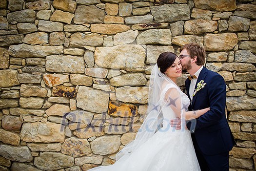 Portrait of a young wedding couple on their wedding day Portrait of a young wedding couple on their wedding day