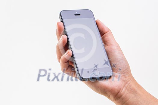 Female hand holding a smart phone, isolated on white Female hand holding a smart phone, isolated on white