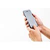 Female hand holding a smart phone, isolated on white