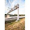 truck passing through a toll gate on a highway (motion blurred image; color toned image)
