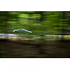 Car going fast on a hughway (motion blurred image)