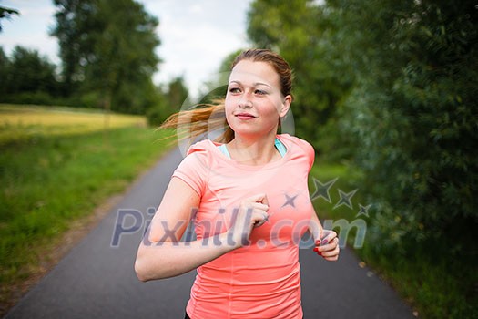 Young woman running outdoors on a lovely sunny winter/fall day Young woman running outdoors on a lovely sunny winter/fall day
