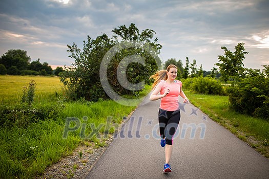 Young woman running outdoors on a lovely sunny winter/fall day Young woman running outdoors on a lovely sunny winter/fall day