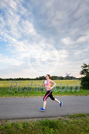 Young woman running outdoors on a lovely sunny winter/fall day (motion blurred image) Young woman running outdoors on a lovely sunny winter/fall day (motion blurred image)