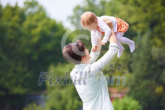 happy mother and baby child in park making first steps . Walking and hugging. happy mother and baby child in park making first steps . Walking and hugging.