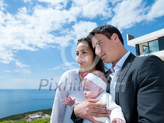 happy young family couple with beautiful new born baby have fun at modern home happy young family couple with beautiful new born baby have fun at modern home