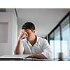 frustrated with problems young business man working on laptop computer at home