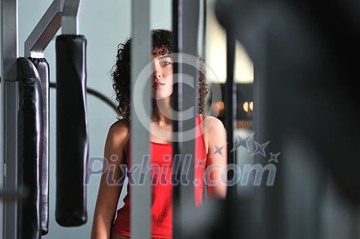 young woman practicing fitness and working out in a gym