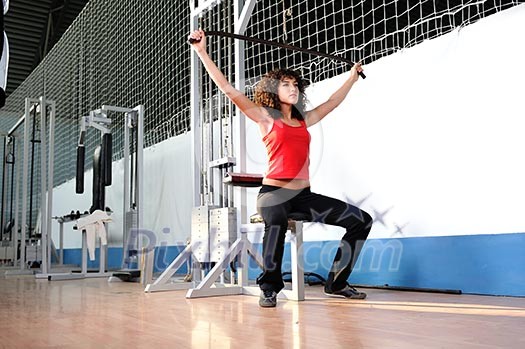 young woman practicing fitness and working out in a gym young woman practicing fitness and working out in a gym