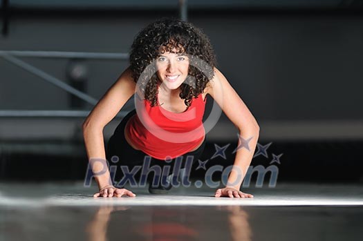 young woman practicing fitness and working out in a gym young woman practicing fitness and working out in a gym