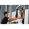 woman in the fitness gim working out with personal trainer coach