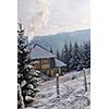 wooden winter house at early morning
