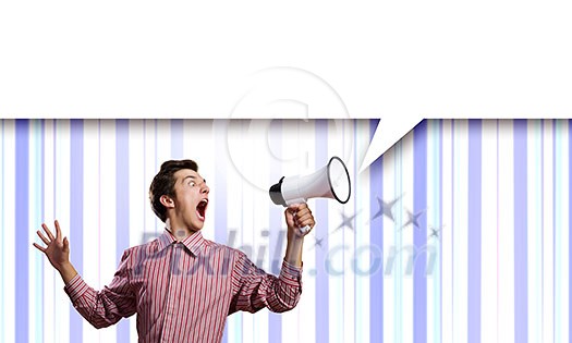 Young man in casual screaming in megaphone Young man in casual screaming in megaphone