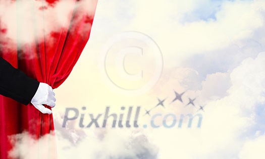 Hand of businessman opening red velvet curtain Hand of businessman opening red velvet curtain