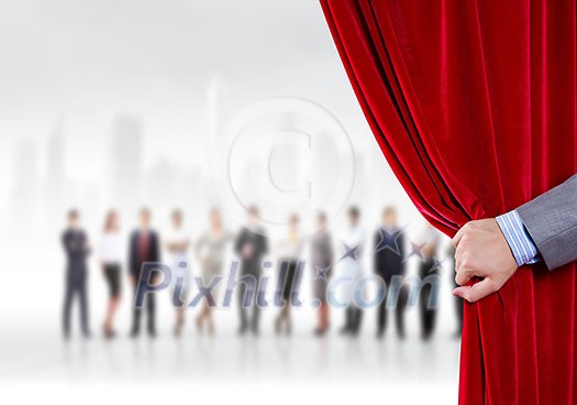 Hand of businessman opening red velvet curtain Hand of businessman opening red velvet curtain