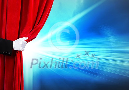 Human hand in white glove opening red velvet curtain Human hand in white glove opening red velvet curtain
