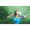 Young blond girl in blue dress listening music