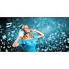 Young blond girl in blue dress listening music