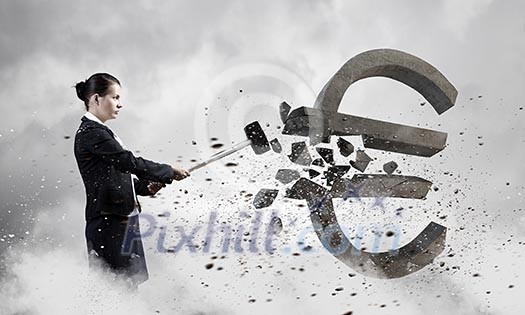 Young businesswoman crashing with hammer stone euro symbol Young businesswoman crashing with hammer stone euro symbol