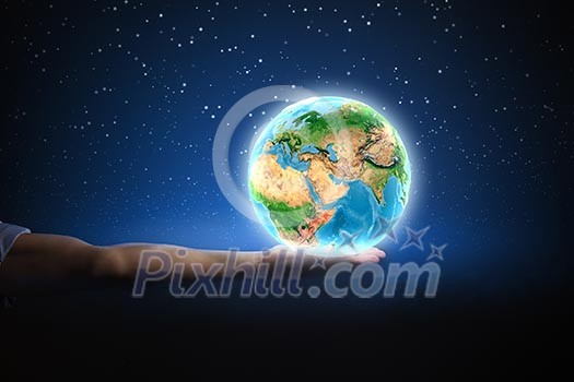 Close up of human hand holding Earth planet. Elements of this image are furnished by NASA Close up of human hand holding Earth planet. Elements of this image are furnished by NASA