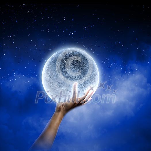 Close of man hands holding moon planet Close of man hands holding moon planet