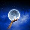 Close of man hands holding moon planet